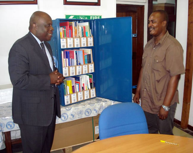 WHO Representative, Dr. Rufaro Chatora, handing over the Blue Trunk Library to the Principal of the Nursing School