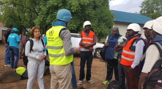 Mr Sylvain Paul Denarie briefing the WHO team on the arrangements for evacuations