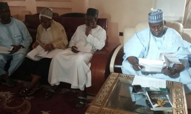 Adamawa State Deputy Governor reading the TOR at the inaugural meeting of the TFI