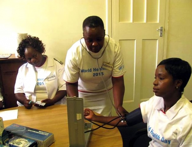 One of the participants getting her blood pressure checked in one of the screening booths