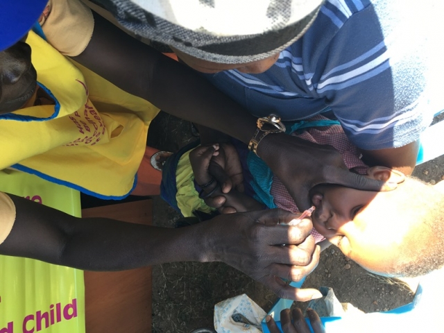 A child being vaccinated against polio in Juba