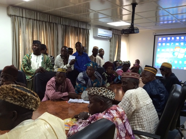 Traditional leaders in a meeting with Liberian authorities and representatives of WHO