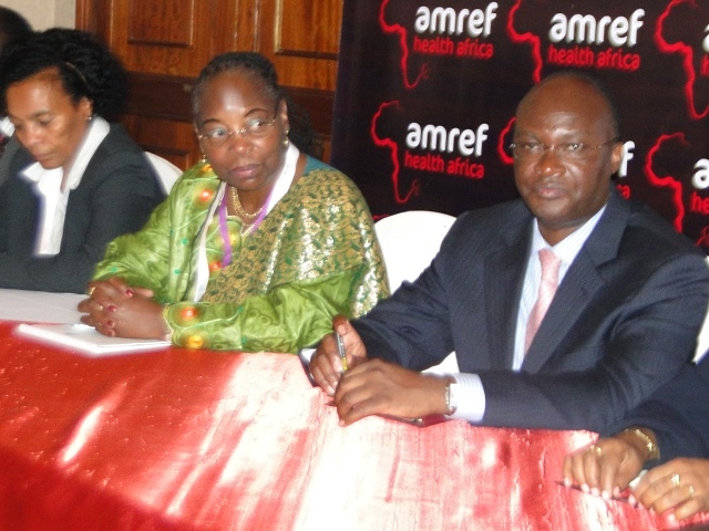 Kenya’s WHO country Representative Dr Custodia Mandlhate (in green) with Health Secretary Mr James Macharia at the 3-day Africa Health Conference which opened in Nairobi, November 24, 2014. The conference called for African-based solutions to health challenges.