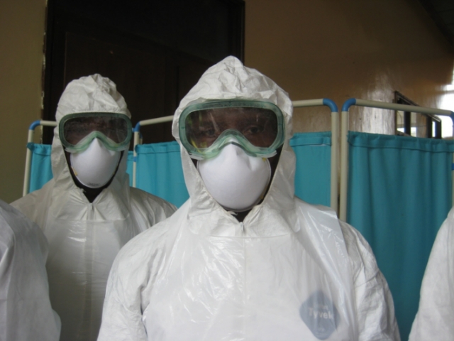 Healthcare workers in personal protective garbs provided by WHO