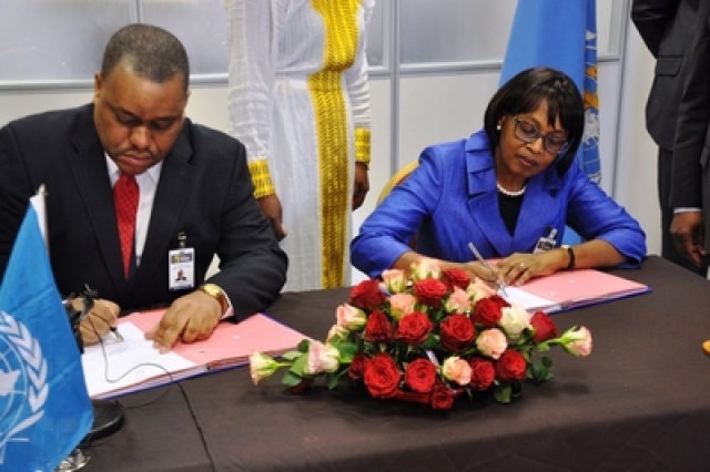 Mr Garry Conille, UNOPS Regional Director for Africa, and Dr Matshidiso Moeti, WHO Regional Director for the African Region, sign MOU on health care delivery in Africa.