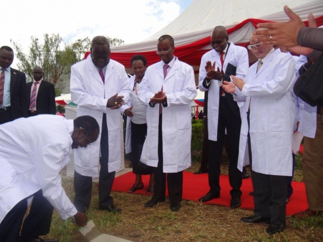 H.E. James Wani Igga laying the foundation stone