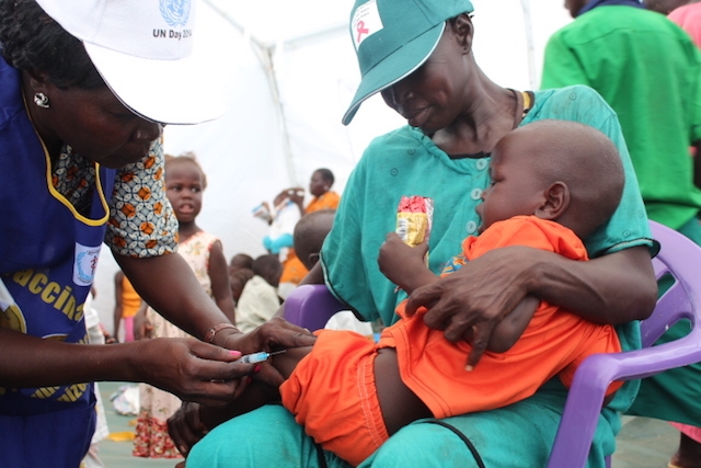 A child receives an injection as part of the package offered by WHO to mark UN Day.