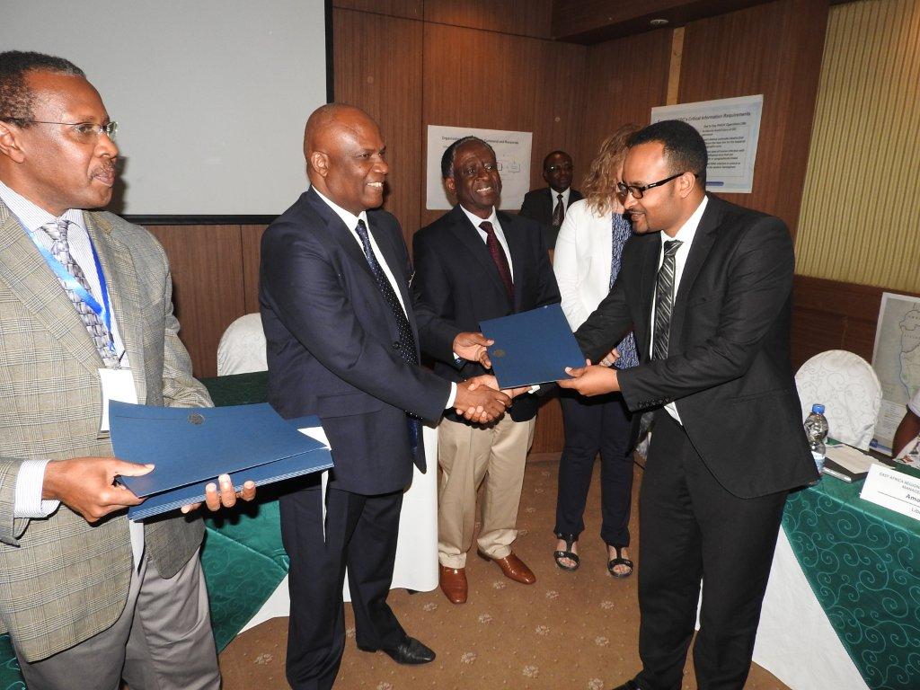 The  Chief Medical Officer handing over Certificate of Participation to Dr Aschalen Workineh from the MoH Ethiopia