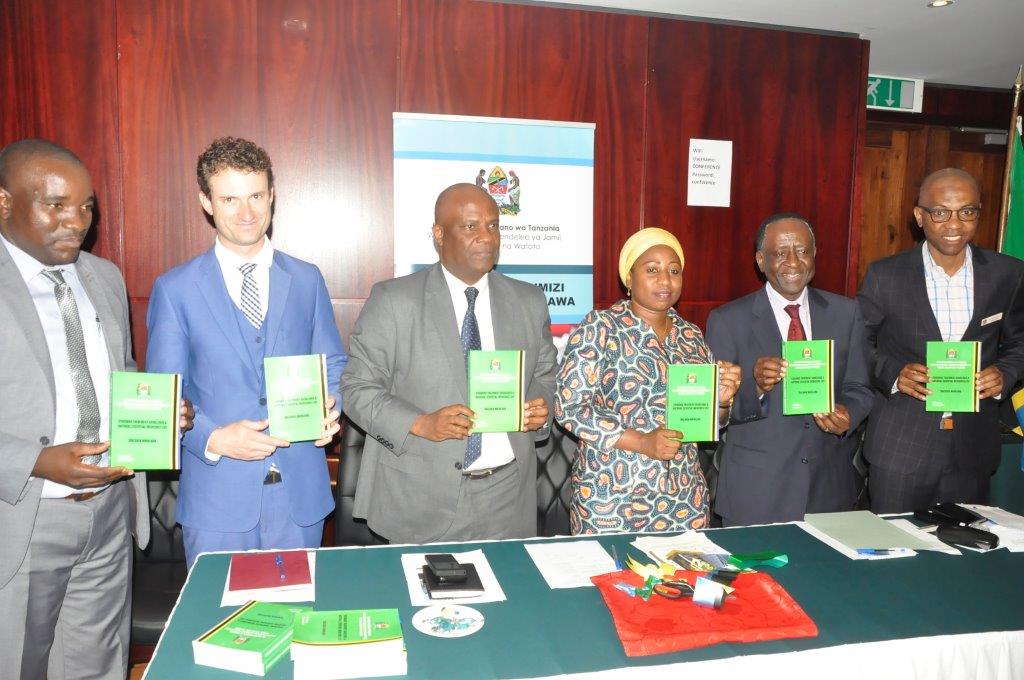 Dignitaries proudly showing the STG/NEMLIT. From Left to right: Mr Daudi Msasi, the Chief Pharmacist, Dr. Gavin Surgey from PRICELESS South Africa,  Dr. Mohammed Bakari Kambi, the Chief Medical Officer,  Honourable Ummy Ally Mwalimu, Minister of Health, Community Development, Gender, Elderly and Children,  Dr. Matthieu Kamwa, WHO Representative a.i, and Dr Mohammed Ali Mohammed, Director, Health Quality Assurance.