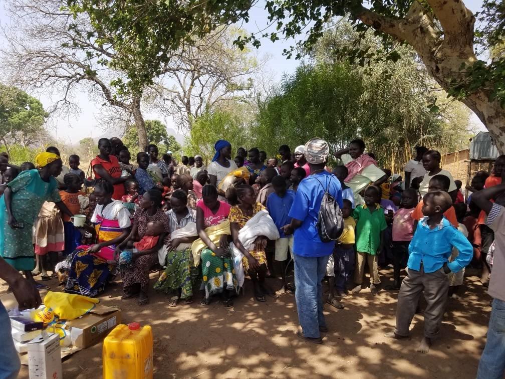 Women with their children waiting in line for a vaccination