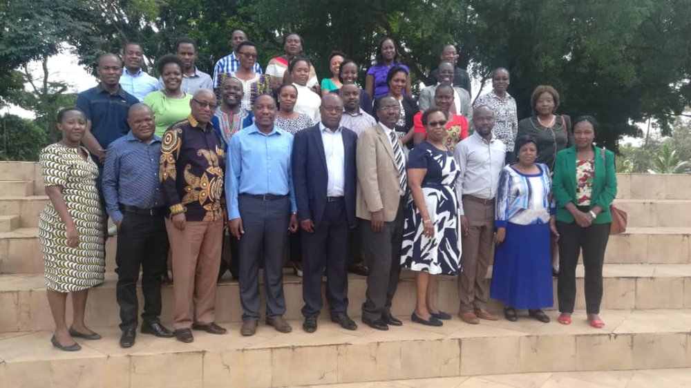 Training participants and facilitators in a group photo