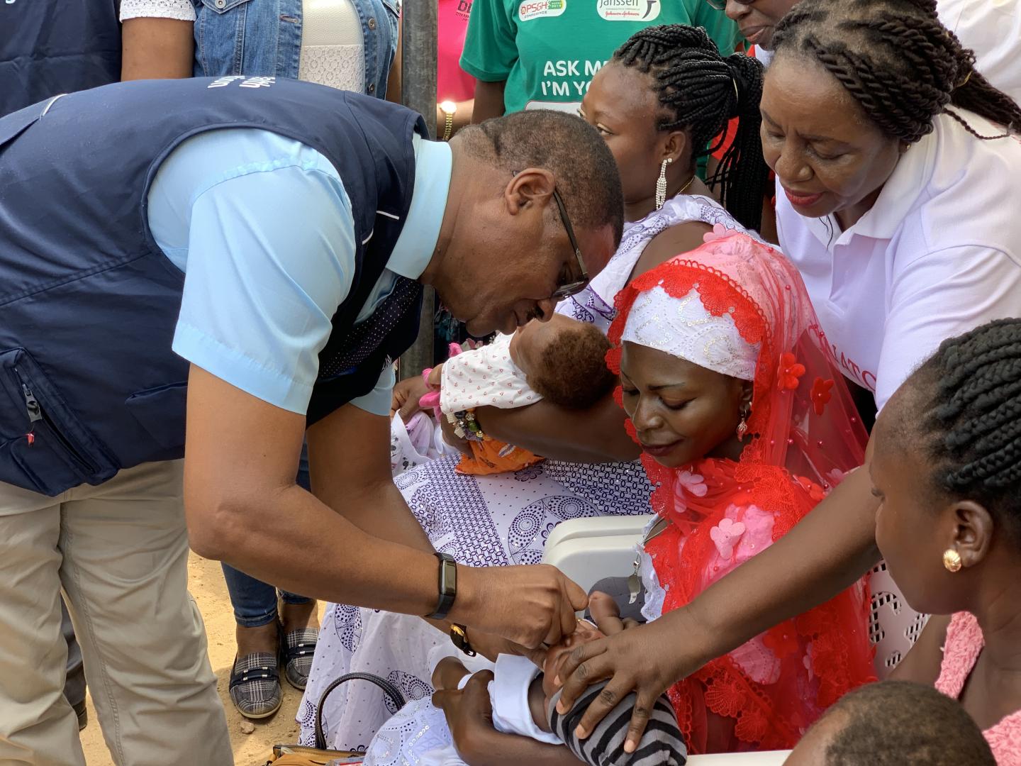 Country Representative of WHO, Dr Owen Kaluwa vaccinating a baby