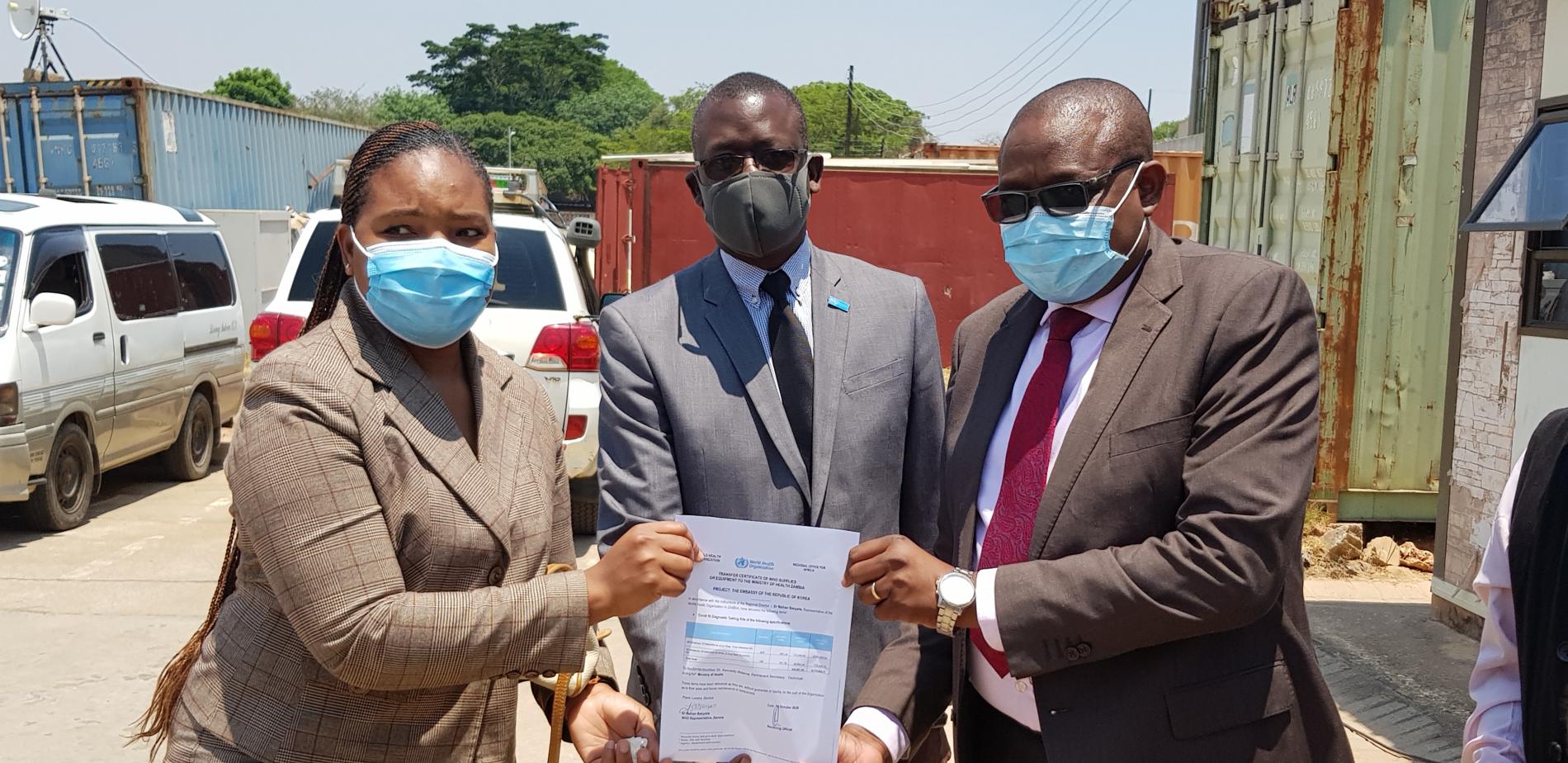 (L to R) Ms Diana Nciwa Kolala, representing Honorary Consul to Zambia, , WHO Representative, Dr. Nathan Bakyaita , Permanent Secretary- MOH,Dr. Kennedy Malama