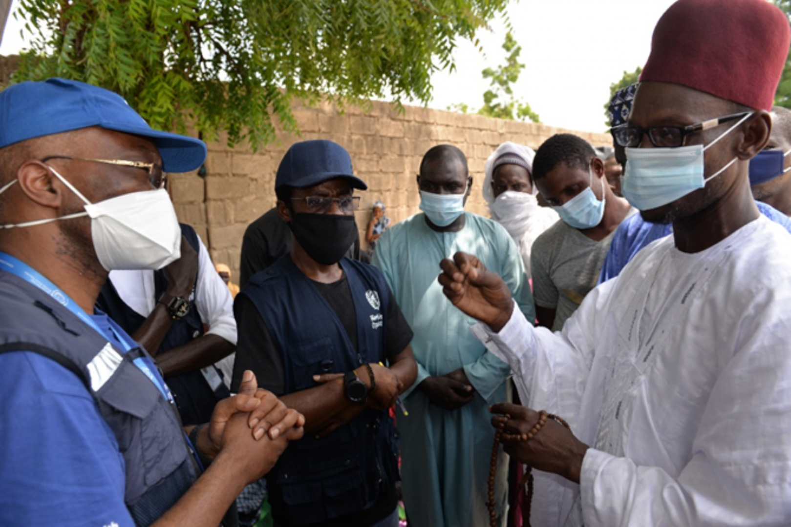 WR with a traditional leader in Borno State discussing community engagement for COVID-19 response.png 