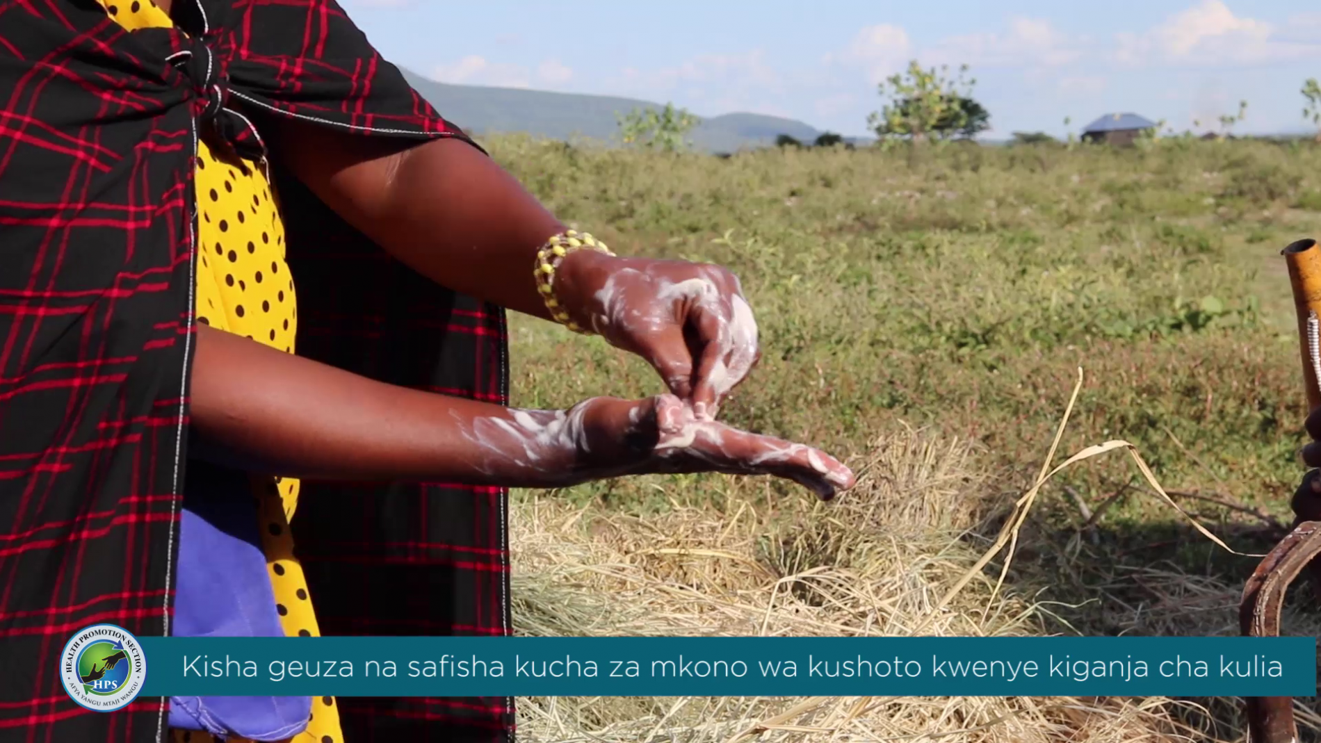 Hand hygiene demonstration by a Maasai woman