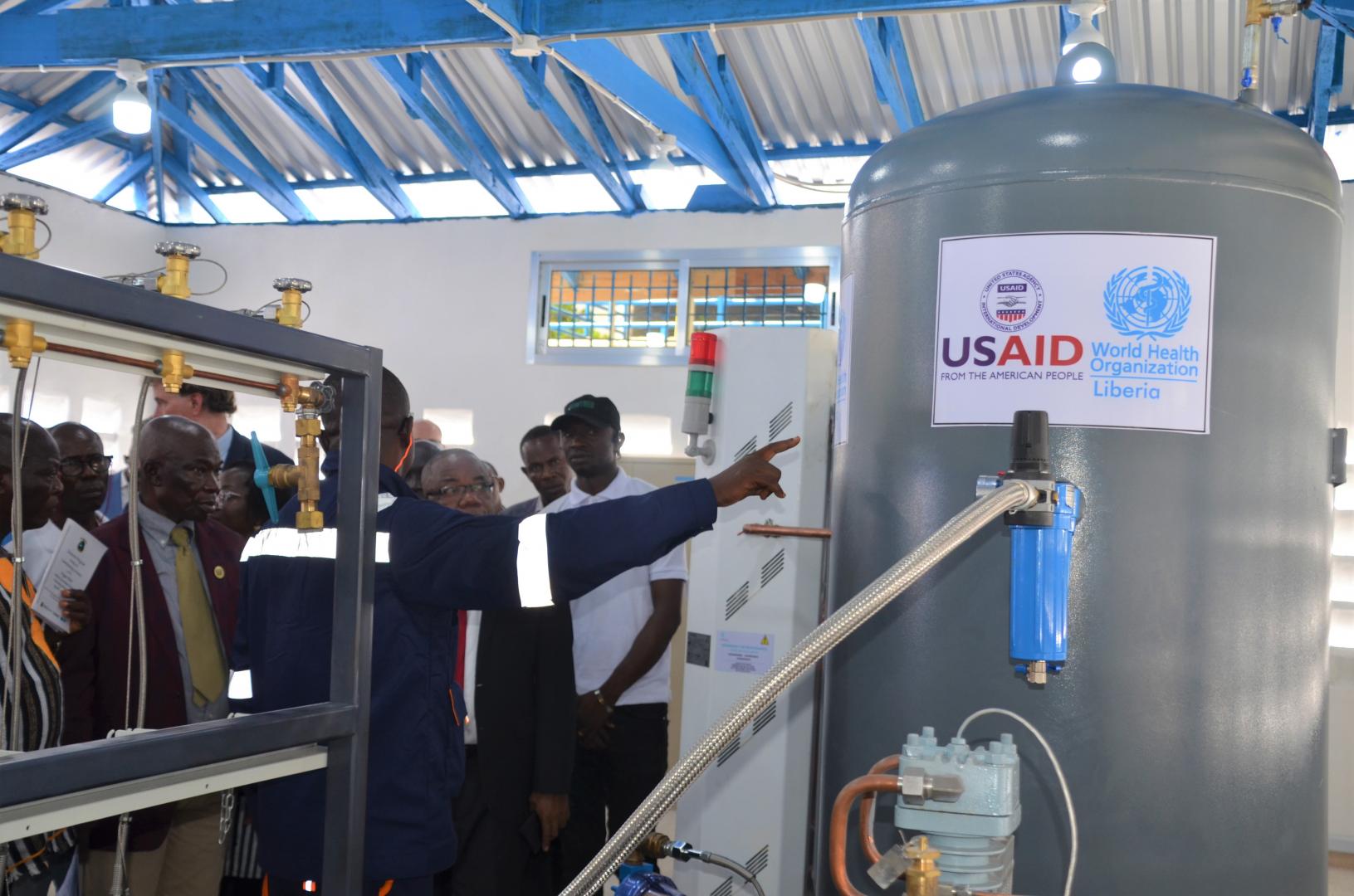 One of the technicians takes the guest through the oxygen production process