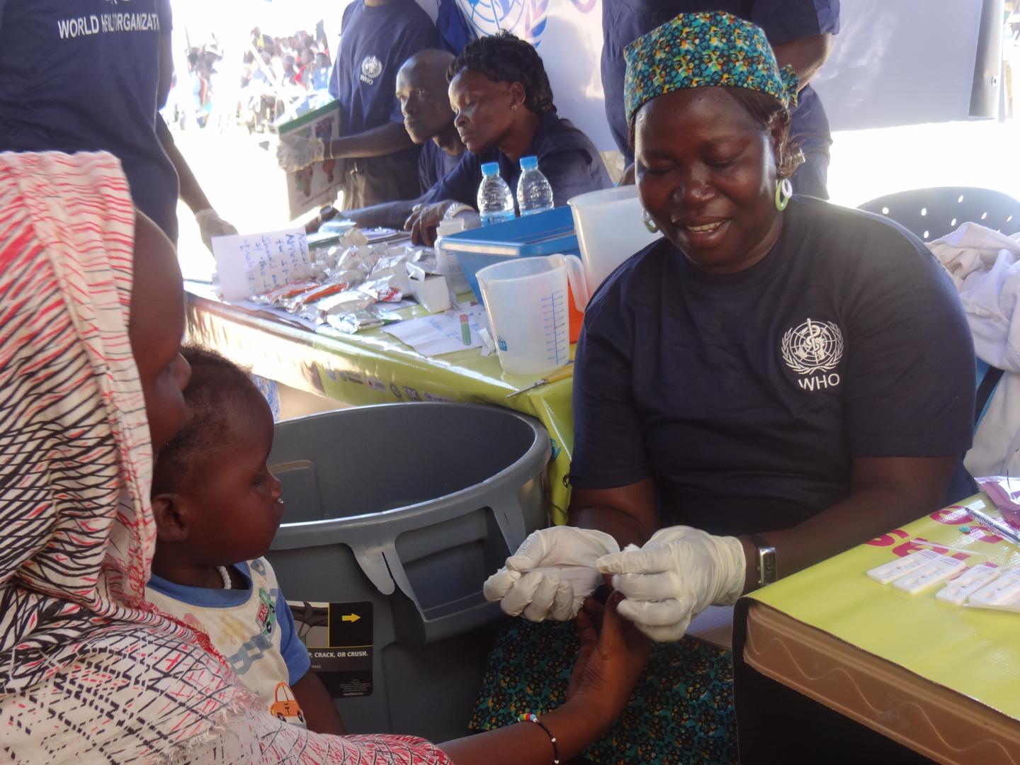 A woman is tested for malaria as part of activities to mark the UN Day