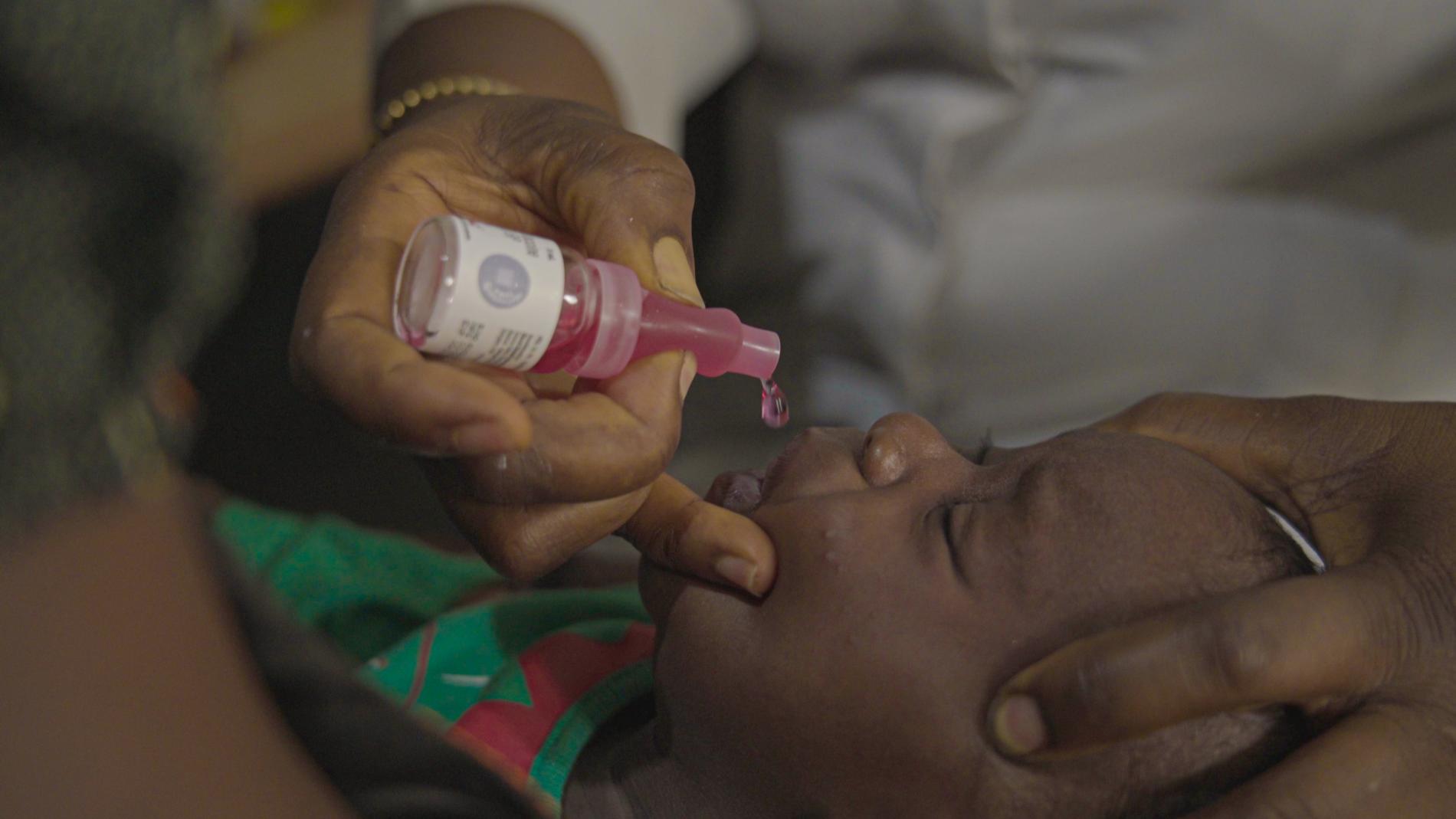 A child recieving the rotavirus vaccine at a health centre in Abuja