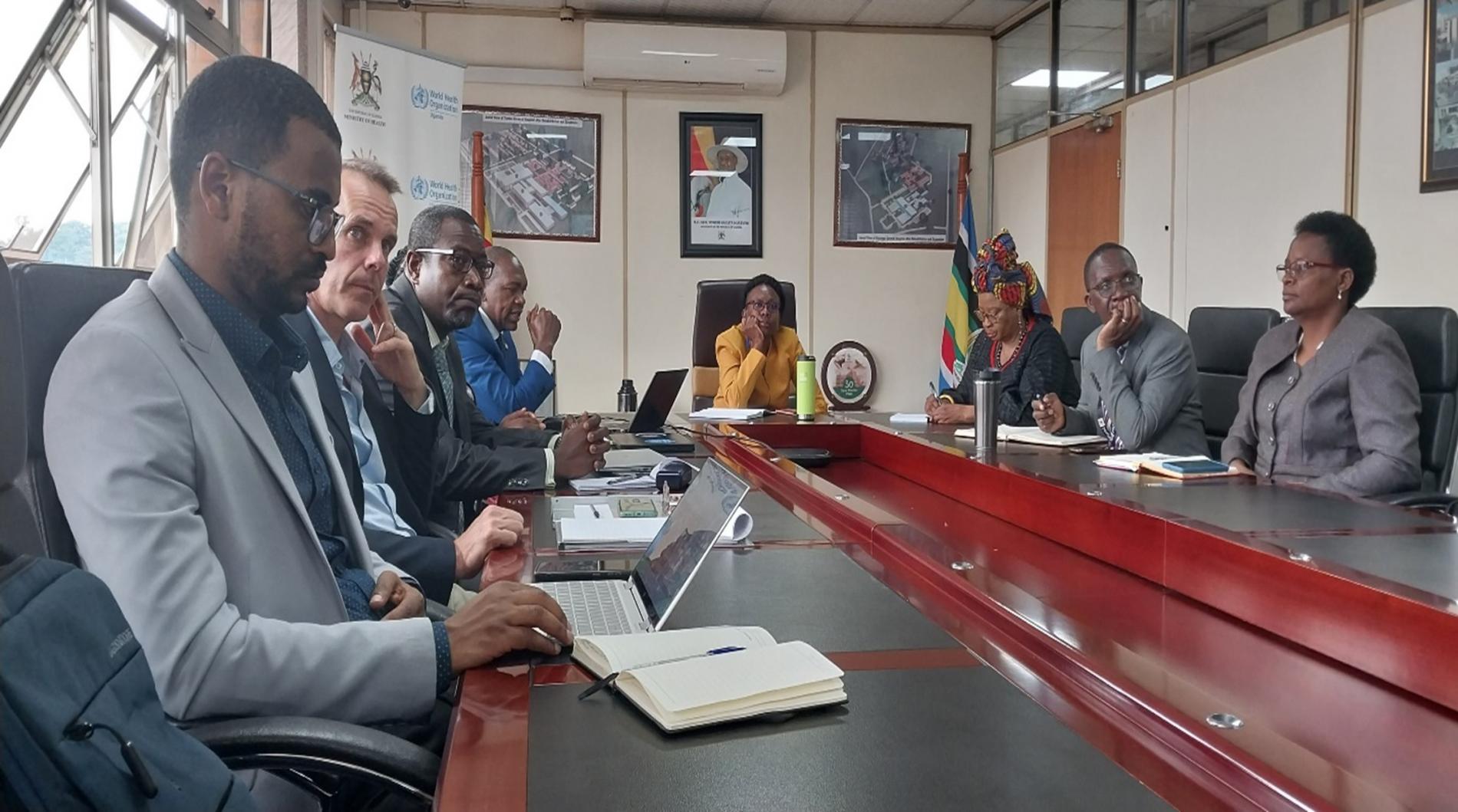 A team from WHO briefs Health Minister Dr. Jane Ruth Aceng