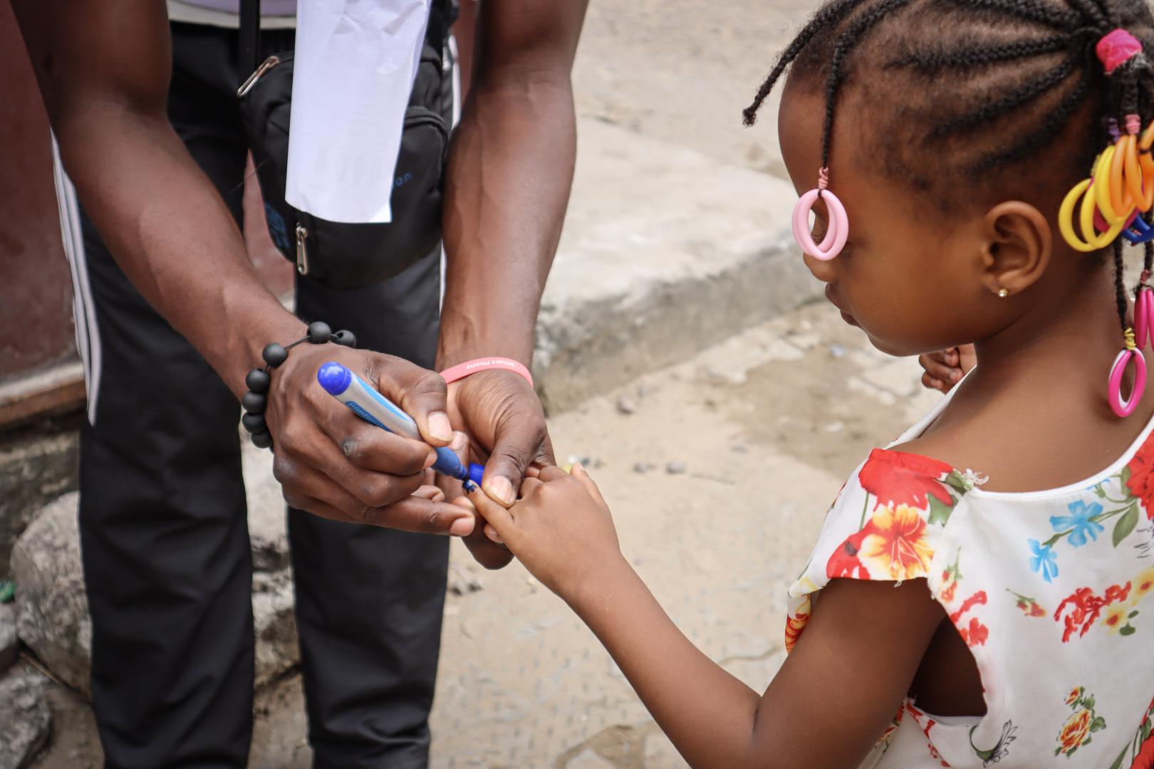 Once children are protected against polio, they are marked on their fingers to confirm their vaccination status