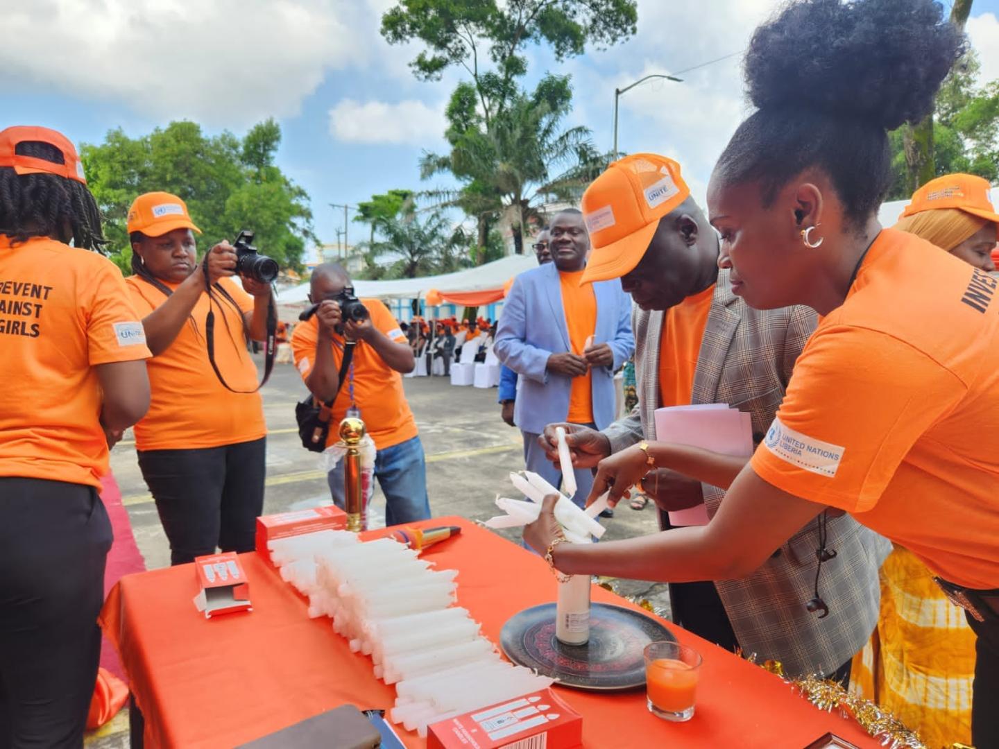 Dr. Peter Clement , WHO country  Representative lights a candle of hope during the commemoration of the 16 Days of activism 