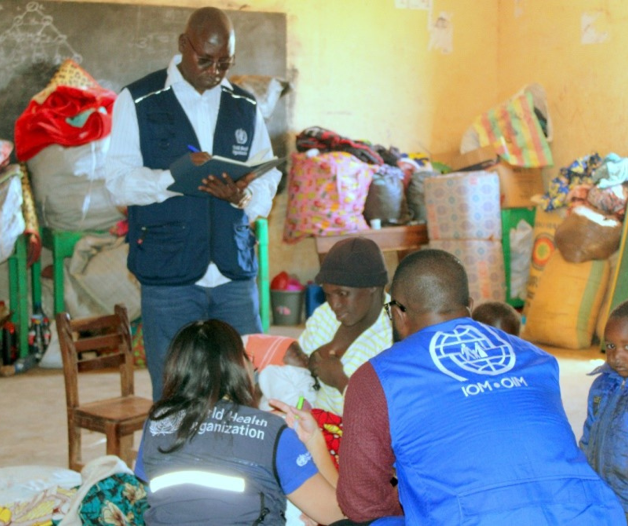 Mother who gave birth to a baby at IDP camp in Mangu interacting with WHO and IOM officials during an assessment of the IDP camp.jpg