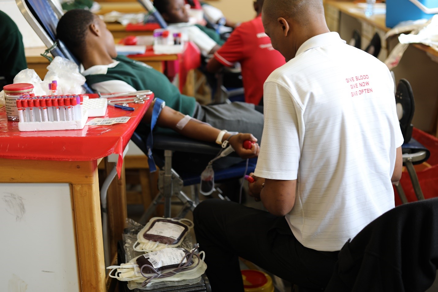 A student donating blood at Nyetane High School 