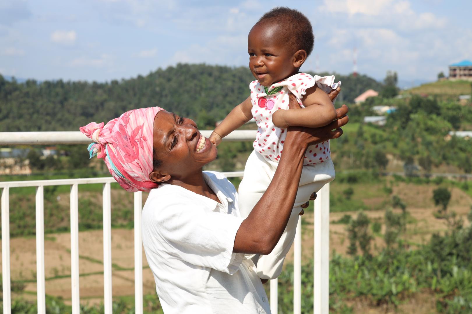 Umutoniwase Marie-Claire playing with her daughter Ornella