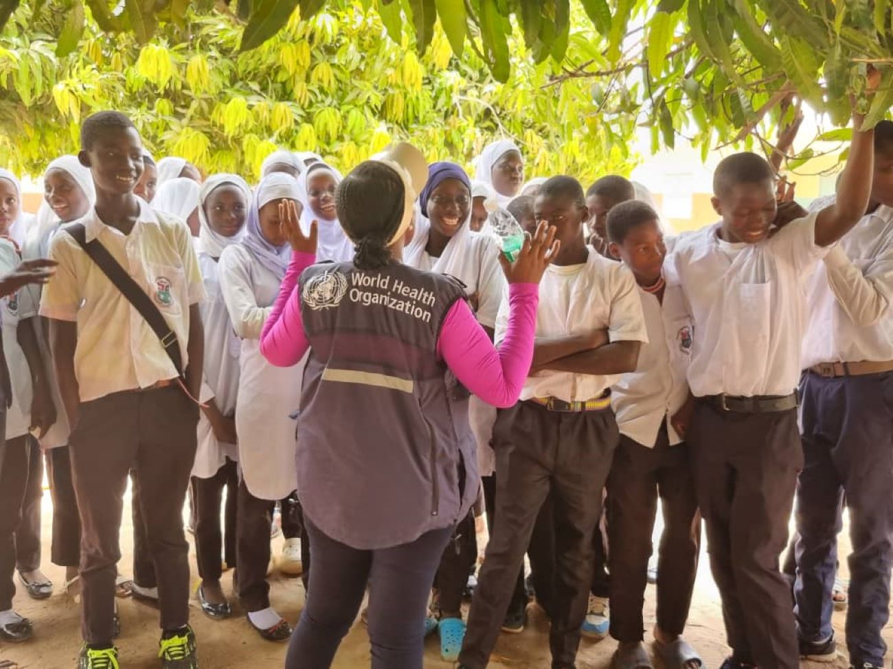 WHO Country Rep, Dr. Jane Maina, talks to students during the MDA campaign