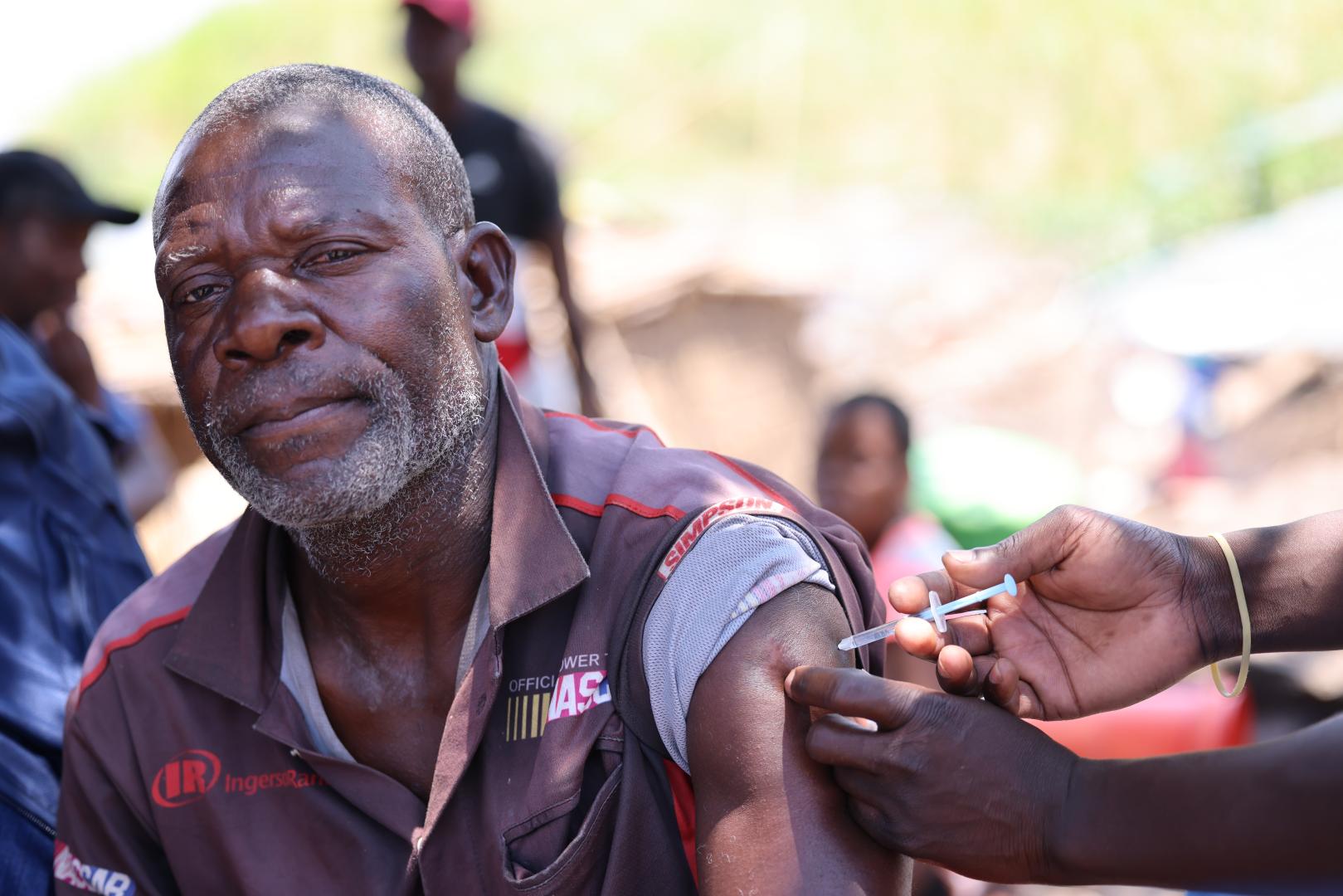 Namita proudly receives his first Covid-19 Vaccine dose