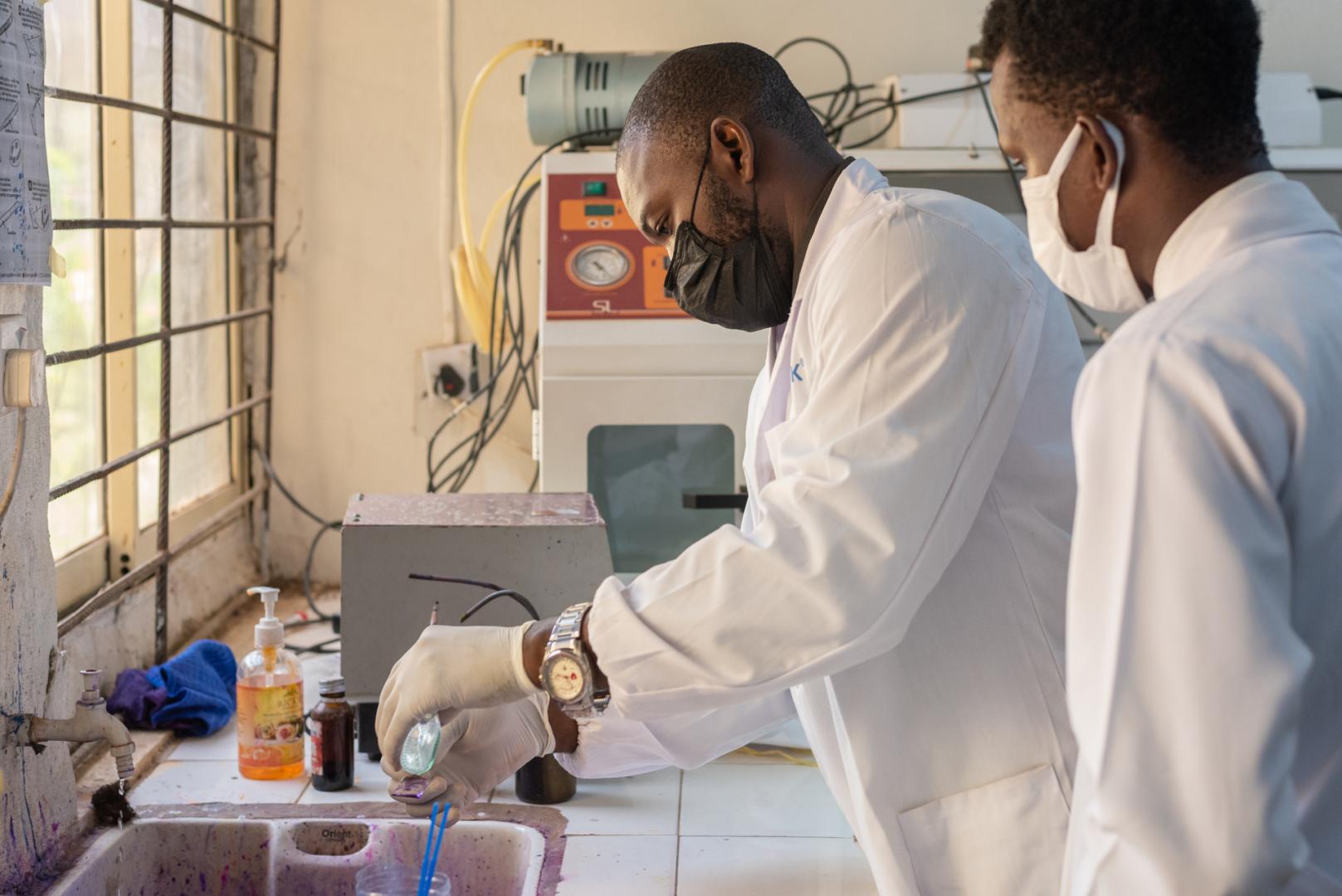 Dr Oladele applies Lugol’s iodine on a smear at the microbiology laboratory in the Department of Medical Microbiology and Parasitology at the Obafemi Awolowo University Teaching Hospitals.