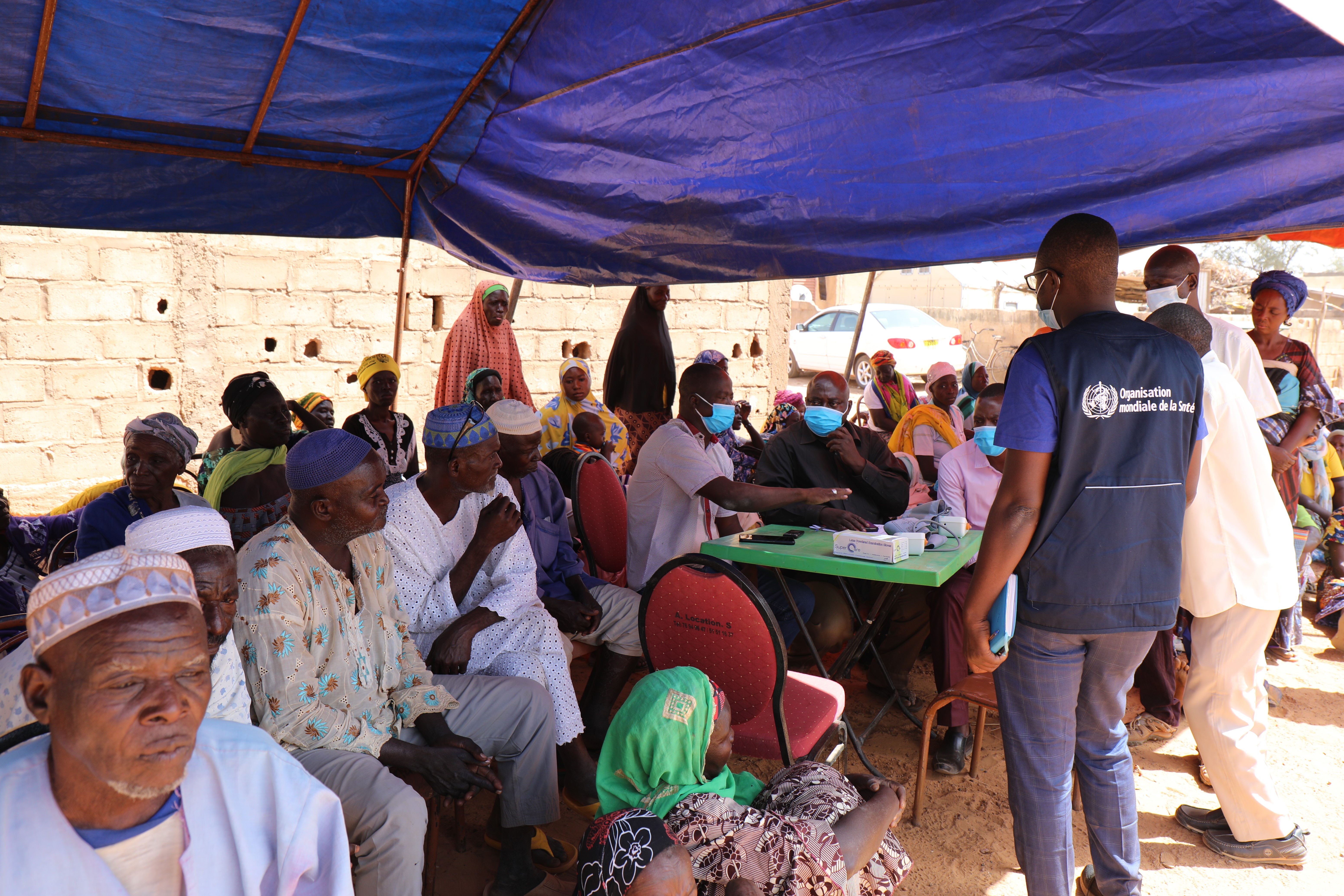 People under a tent