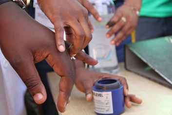 Lorenzo, who was in the long queue to be vaccinated and to dip his finger in blue ink to confirm his vaccination status