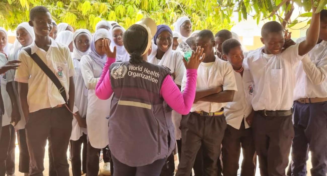 WHO Country Rep, Dr. Jane Maina, talks to students during the MDA campaign