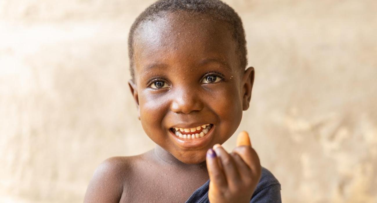 A happy child after being vaccinated for polio