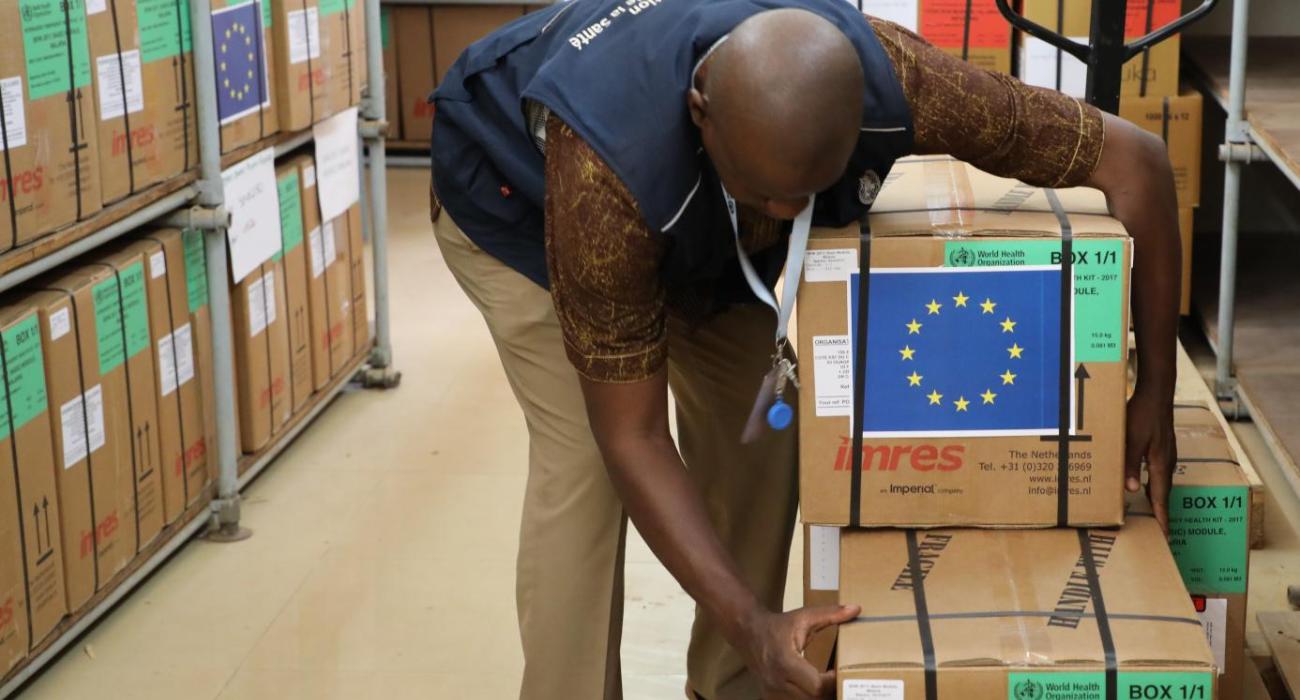 A man carrying medical boxes