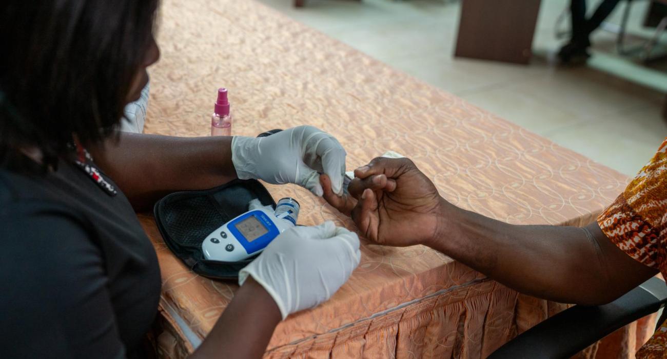 A blood glucose test measuring the amount of glucose in a sample blood