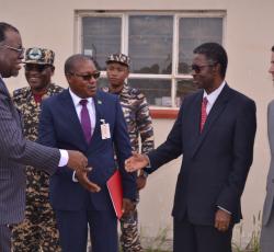 President of the Republic of Namibia His Excellency Dr Hage Geingob reaching out to greet WHO Representative Dr Charles Sagoe-Moses at the Hosea Kutato Airport outside the isolation facility at the airport 