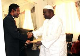 Dr. Sagoe-Moses in a brotherly gesture, warmly hands over his credentials to the Hon. Min. for Foreign affairs, Dr. Aboubacarr Senghore