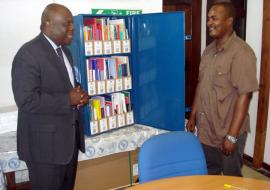 WHO Representative, Dr. Rufaro Chatora, handing over the Blue Trunk Library to the Principal of the Nursing School