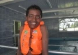 Muaz Reshid with a radiant smile at the hydrotherapy facility.