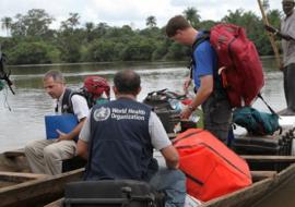 WHO mobile lab scientists at the crossing point between Guinea and Sierra Leone. WHO/Saffea Gborie