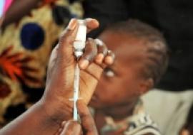 Young Gambian child waiting to be immunized with MenAfriVac