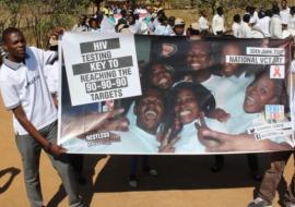 The marchers displaying their banners showing the national VCT Day 2016 campaign theme in Mumbwa district