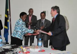 The Head of Operations in the Delegation of the European Union in Tanzania, Mr Eric Beaume, exchanging the signed memorandum of understanding with the Permanent Secretary for Ministry of Health and Social Welfare, Ms. Regina Kikuli during the ceremony.