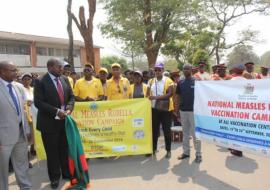 Minister of Health, Hon. Chitalu Chilufya flagging off the march at the launch of the national MR vaccination campaign in Lusaka.