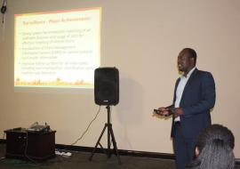 One of the external reviewers from IST Mr Anderson Chinorumba delivering findings of the review during a meeting at Happy Valley Hotel.