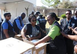 WHO staff in action at the hand over ceremony