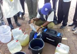 Mr Alex demonstrating water quality testing and treatment for National Public Health officers in Juba