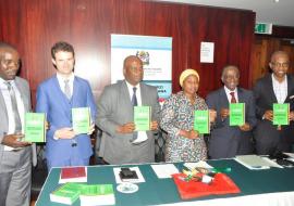 Dignitaries proudly showing the STG/NEMLIT. From Left to right: Mr Daudi Msasi, the Chief Pharmacist, Dr. Gavin Surgey from PRICELESS South Africa,  Dr. Mohammed Bakari Kambi, the Chief Medical Officer,  Honourable Ummy Ally Mwalimu, Minister of Health, Community Development, Gender, Elderly and Children,  Dr. Matthieu Kamwa, WHO Representative a.i, and Dr Mohammed Ali Mohammed, Director, Health Quality Assurance.